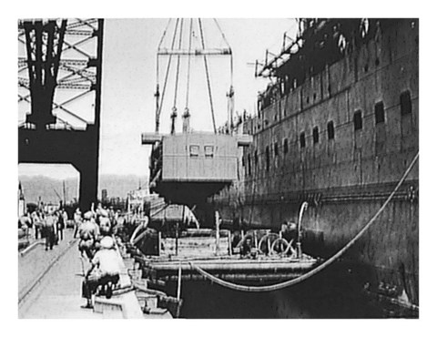 8-inch turret being removed from USS Lexington, 30 March 1942 — photo C
