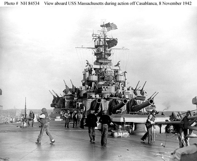 USS Massachusetts BB-59 combat damage — shell holes near ensigns and radar