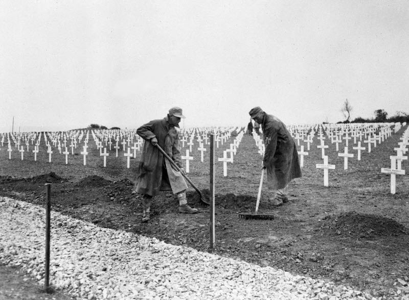 German prisoners work at first US cemetery near Omaha Beach