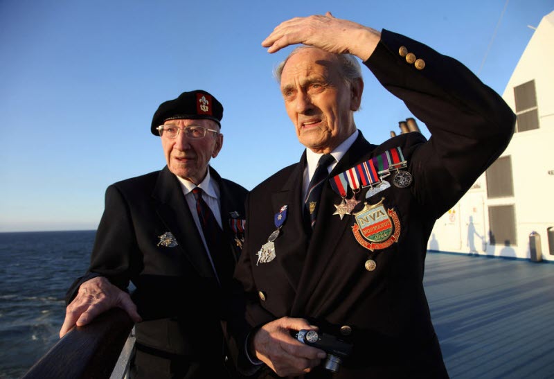 Normandy veterans look at French coastline from ferry 2009