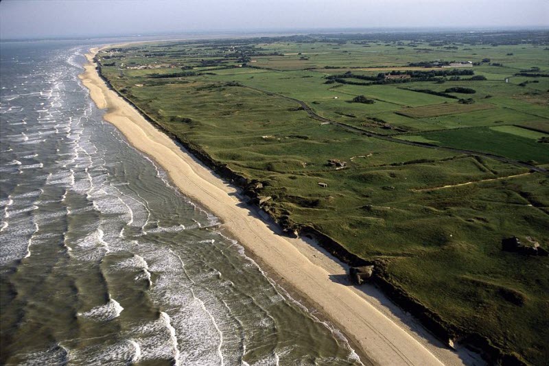 Broad sands of Utah Beach with remains of German fortification